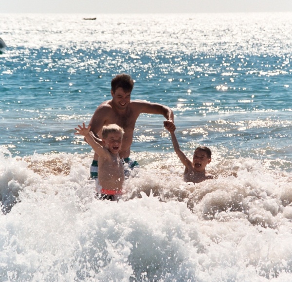 Jeff frolics with our sons in Maui, Hawaii, 1991