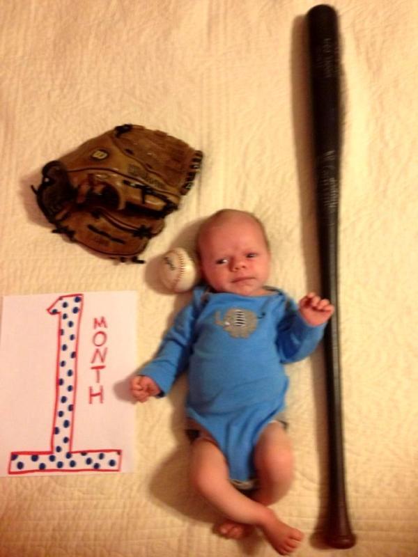 This is Drew's idea of a 1-month portrait.  This guy is SERIOUS about baseball.  Grady looks as if he is thinking, "Whatever baseball is, I hope I like it or I'm TOAST."