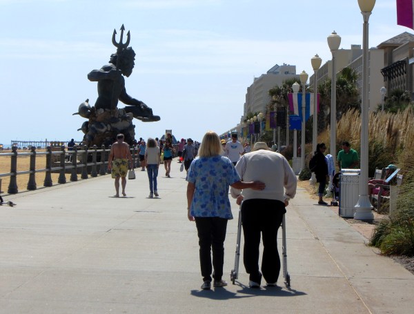 Strolling past Poseidon on the boardwalk, Virginia Beach, September 2013.