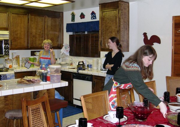Janet and her daughters prepare yet another Christmas Eve dinner, 2002