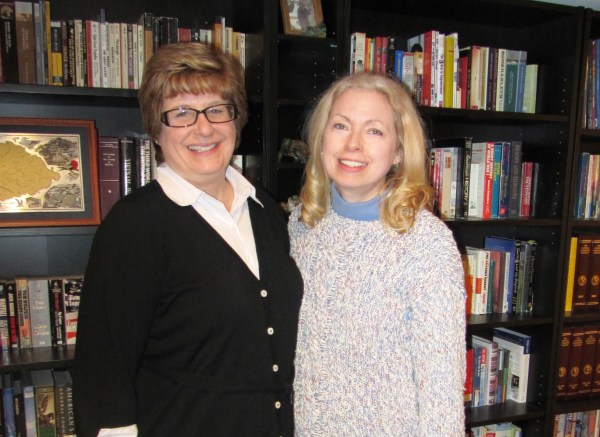 Amy and me with a teeny-tiny section of her family's BOOKS! February 2012