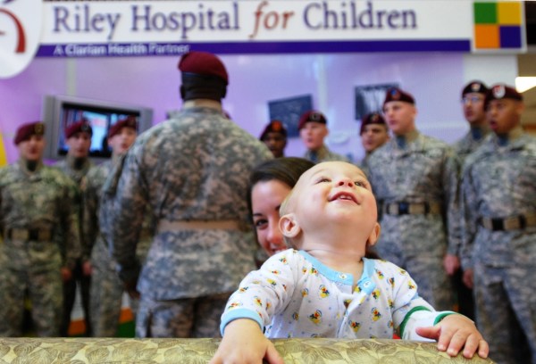 A very young patient enjoys singing by the 82nd Airborne Division Chorus, who visited Riley Hospital for Children in Indianapolis, Indiana, July 2008. "Songs for all ages" by The U.S. Army, Public domain, via Wikimedia Commons