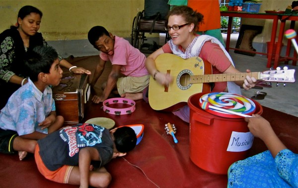 Australian volunteer Kylie Hinde at the Center for Disability in Development, Bangladesh, 2011. Photo by Australian Department of Foreign Affairs and Trade via Wikimedia Commons, CC-BY-2.0