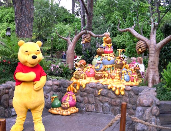 Just thinking about "hunny" makes Pooh happy! Disneyland, Anaheim, CA, April 2003