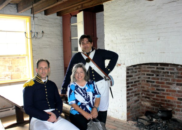 Carla poses with soldiers from the War of 1812, Ft. McHenry, Baltimore MD, August 2010.