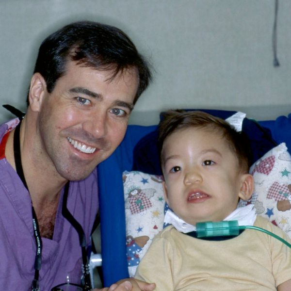 Jeff with one of his youngest patients, San Antonio, Texas, 1996