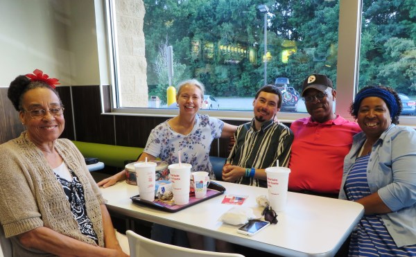 Contagious happiness: Carla snapped this photo of Ms. Ella, Raynard and Mary with Matt and me. That's a yummy chocolate cake in the tin on the table in front of me. But I digress... Virginia Beach, July 2015 