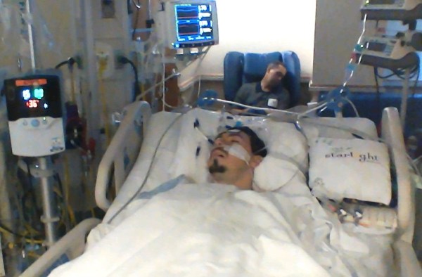 Jeff dozes as Matt recovers from his fifth open heart surgery, April 2014. I took a screen capture of this peaceful moment, a respite amid the intense and exhausting two weeks in the hospital.