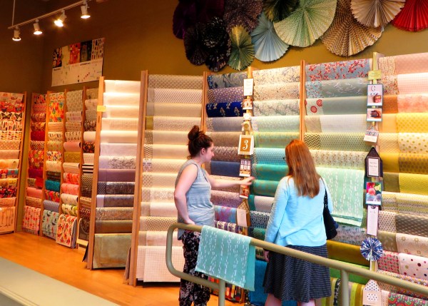 Kelly shares her enthusiasm for paper with a shopkeeper in Old Town Alexandria, April 2015