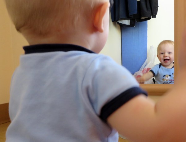 We start off being kind to ourselves, but what happens later? 10-month-old Grady likes what he sees in the mirror at the beach cottage. Dam Neck, Virginia, June 2014