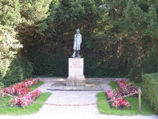 The inscription at the base of this statue at Dachau reads: "To honor the dead, to warn the living." Dachau Concentration Camp, near Munich, Germany, August 2005 